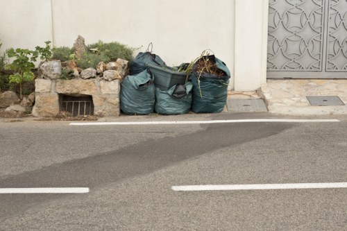 Enclosed lockable skip placed in a residential area of Honor Oak